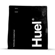 Huel Black Vanilla bottle pouring for a quick meal on the go.