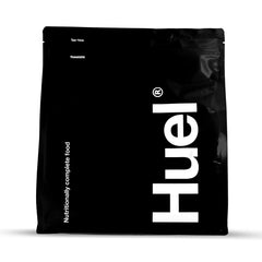 Huel Black Vanilla bottle pouring for a quick meal on the go.