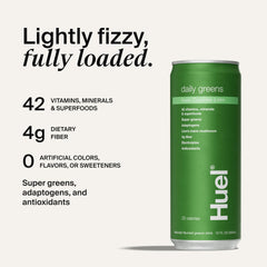 Pouring Huel Daily Greens into a glass for a fruity morning boost