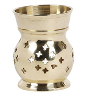 IBA Indianbeautifulart brass oil burner with patterned openings glowing warmly for ambient aroma diffusion.