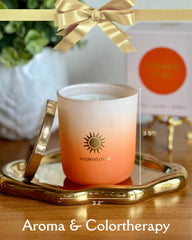 Inspired Picks Orange Candle with gold sun symbol lid enhances luxury decor.