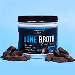 Glass of blended chocolate protein shake with Intentionally Bare bone broth powder