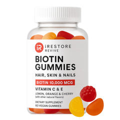 iRestore Biotin Gummies orange bottle promoting hair and nails support.