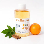 Iron Banyan Aromatherapy Blend bottle pour for a cozy, inviting atmosphere.