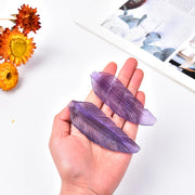 JIC Gem feather-shaped fluorite ornament on desk enhances decor and focus