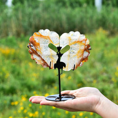 JIC Gem hand-carved orange quartz heart with wings enhances modern interiors.