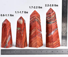 JIC Gem red jasper tower on wood base with natural texture and display appeal.
