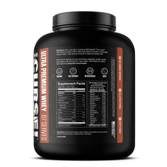 JNX Sports The Curse whey powder being scooped into a glass for quick high-protein shake.