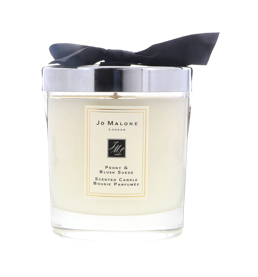 Jo Malone Peony & Blush Suede candle in glass creates refined ambience with floral warmth.