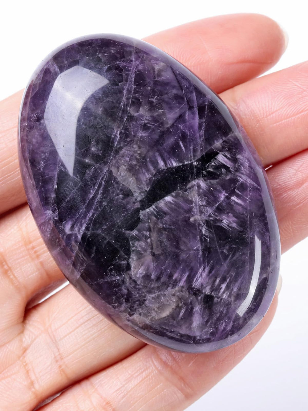 Jovivi amethyst worry stone palm close-up for anxiety relief and calm