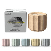 JueOne set in cement jars enhances refined home décor ambiance.