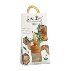 Just Bee diffuser bottle closeup, showcasing teakwood tobacc for small spaces