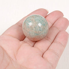 Justinstones Amazonite sphere close-up highlights polished texture and color depth.