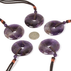 Justinstones Amethyst Peace Donut Pendant closeup showing natural color variations.