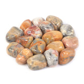 Justinstones Crazy Lace Agate stones in a colorful pile for display.