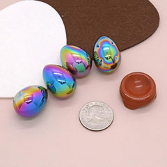 Justinstones hematite egg on red jasper stand, a stylish desk feng shui accent