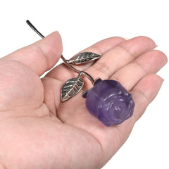 Justinstones Purple Fluorite Rose with silver-plated copper stem on a shelf.