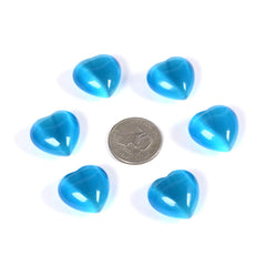 Justinstones sky blue cat's eye heart crystal reflecting light during meditation