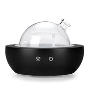Kakoda glass diffuser with real wood base enhances any room ambiance.