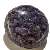 KALIFANO Lepidolite palm stone closeup showing lavender tones and calming energy