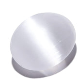 Kalifano selenite palm stone close-up highlighting its smooth surface and calming energy