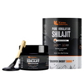 Kama Essentials Shilajit resin bottle on wood, showcasing premium mineral-rich wellness.