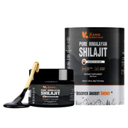 Kama Essentials Shilajit resin bottle on wood, showcasing premium mineral-rich wellness.