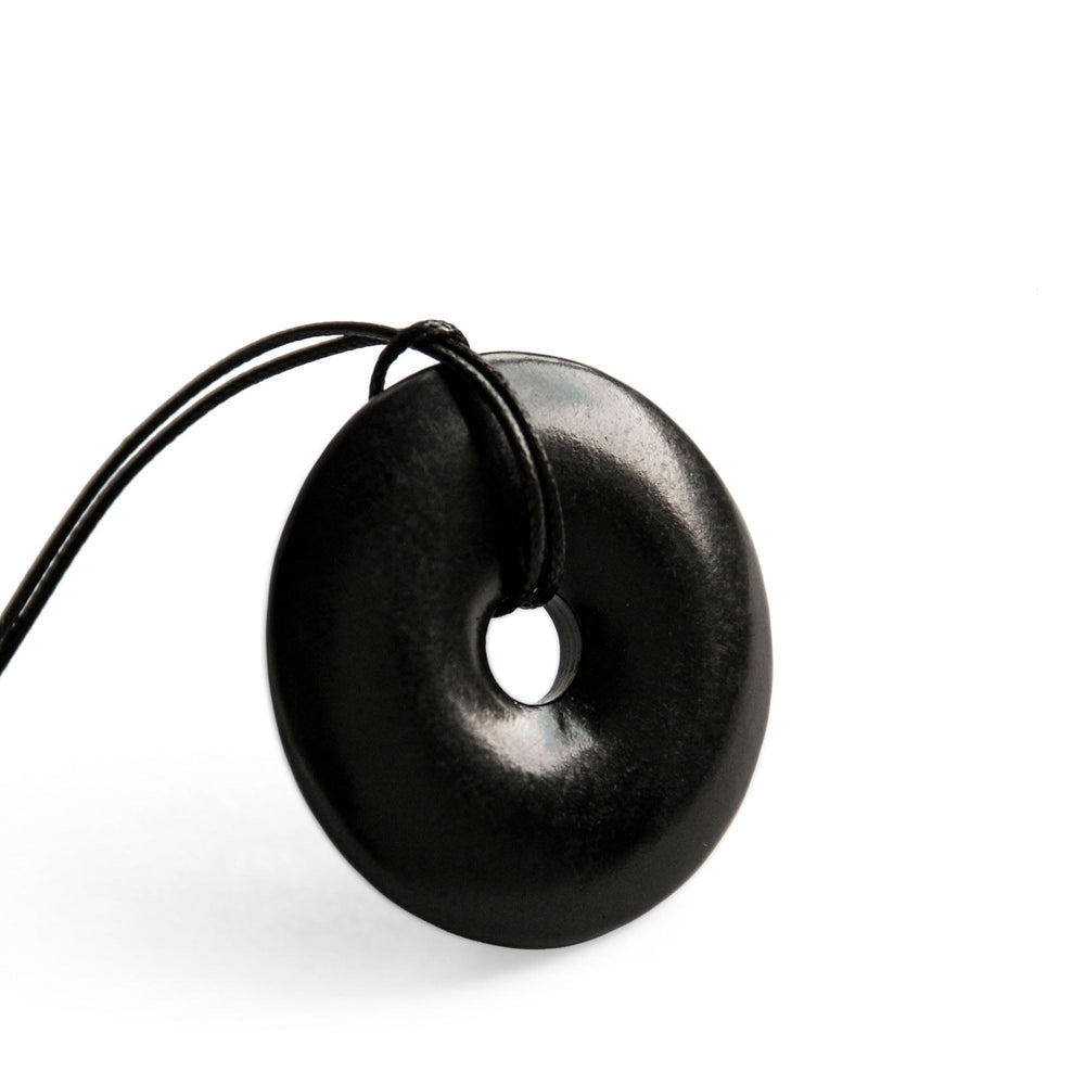 Karelian Heritage shungite protection necklace, front view of doughnut pendant for daily grounding