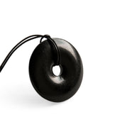 Karelian Heritage shungite protection necklace, front view of doughnut pendant for daily grounding