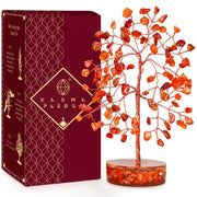 KARMAPLEDGE crystal tree decor with carnelian stones enhances warm ambiance and balance.