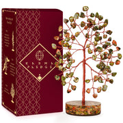 KARMAPLEDGE crystal tree with unakite chakra stones to promote calm on a desk.