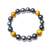 KAVAGOBO Triple Protection Bracelet close-up on tiger's eye bead highlighting confidence
