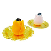 KCVC tulip candle pink on golden tray enhances romantic ambiance.