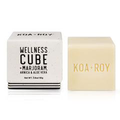 KOA ROY Wellness Cube applied on shoulder for soothing relief.