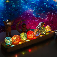 KRISININE 7 chakra spheres on LED stand create a calming meditation ambiance.