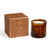 LAFCO New York Holiday Candle in Spiced Pomander resting in its frosted glass vessel.