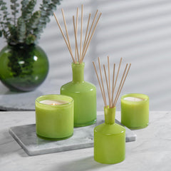 Hand-blown glass details elevate premium home aesthetics around the candle.