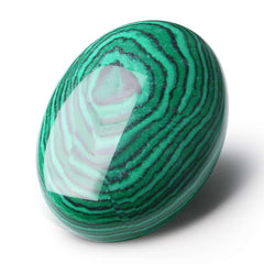 LAIDANLA Malachite palm stone held in hand to promote relaxation and focus.