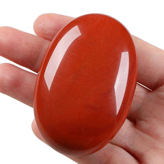 LAIDANLA Red Jasper palm stone in hand ready for portable stress relief and focus