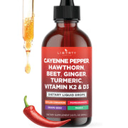 Liberty Lifestyle Cayenne Pepper Drops bottle pour highlighting warming, convenient liquid form for daily use.
