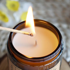 Close-up of Liofeve candle showing clean burn and cotton wick
