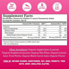 Llama Naturals Vitamin D3 gummies closeup with raspberries highlighting real fruit flavor.