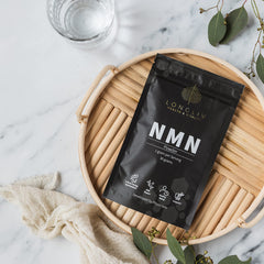 LongLiv NMN powder in jar with label highlighting GMP and third-party testing.