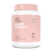 Love Sweat Fitness chocolate protein powder bottle pour shows creamy texture for a post-workout shake