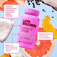Love Wellness Healthy V Vitamin tablet close-up for daily intake.
