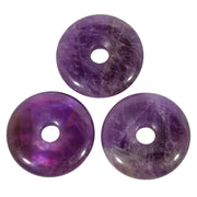 Loveliome crystal donut amulet with large hole, ideal for necklaces and charm projects.