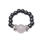 MagneHealth rose quartz ring close-up for balanced energy on the go.