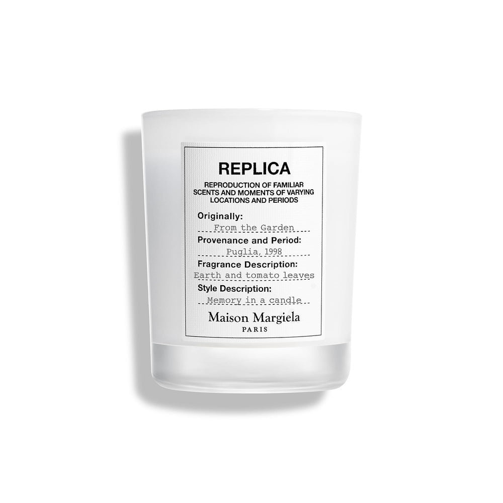 Maison Margiela Replica From The Garden Candle with tomato leaf note brightening the room
