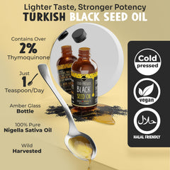 Maju Black Seed Oil glass bottle close-up shows clear color and smooth texture.