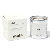 MALA scented silk candle close-up jar showing rich tonka bean aroma for cozy evenings